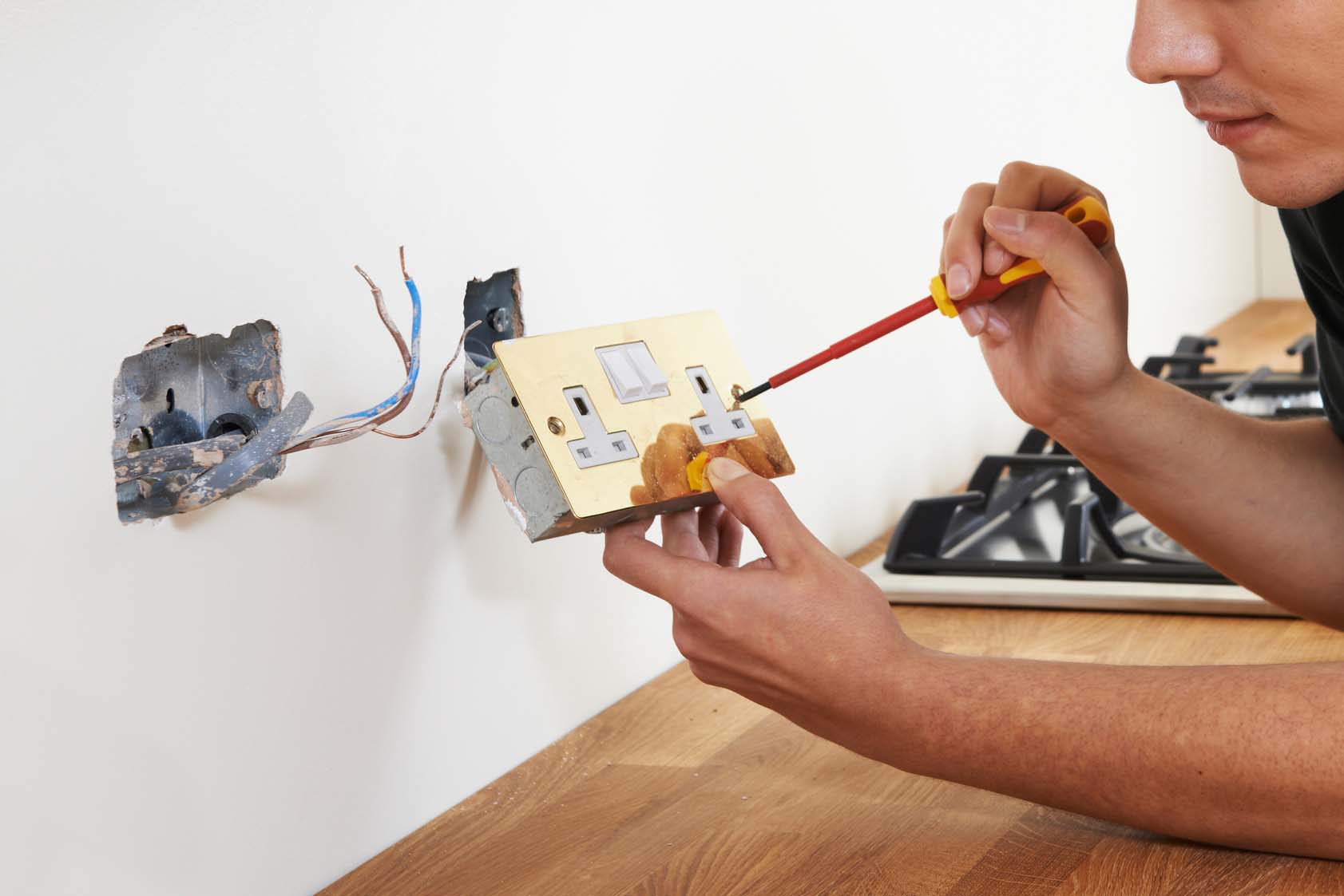 Electrician Installs Socket In New House